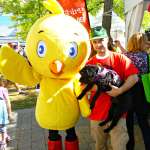 Victor poses with Chirp the Owl Magazine mascot and helping hand